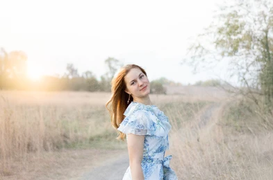 Young woman smiling during her senior pictures in Omaha, NE