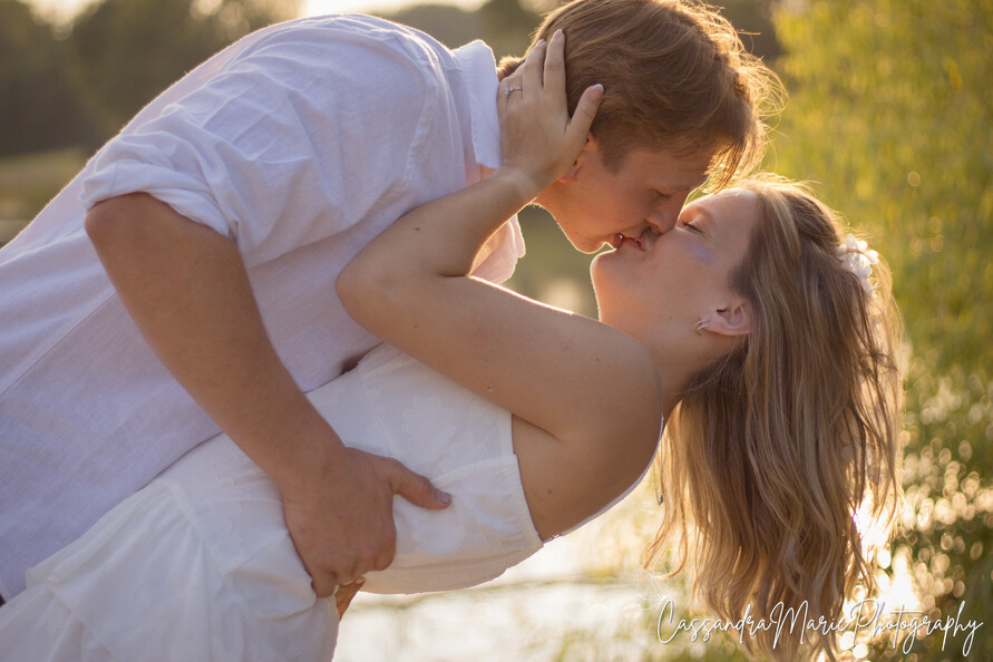 A couple kissing during their engagement photos in Omaha
